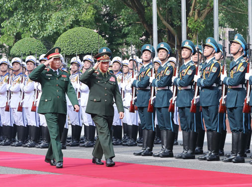 Tăng cường hợp tác quốc phòng Việt Nam - Lào - Ảnh 1.